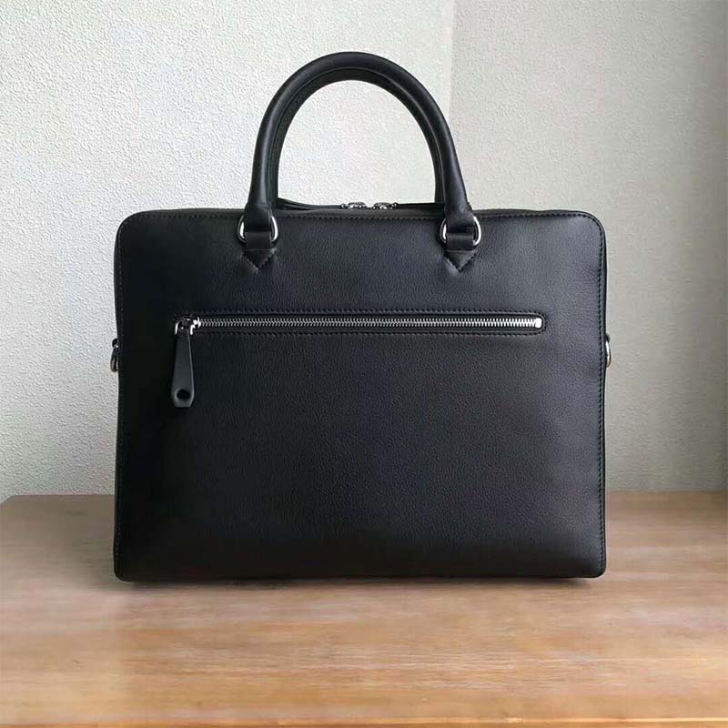 Close-up of zip closure and leather texture on Burberry Men Embossed Crest Leather Briefcase-Black
