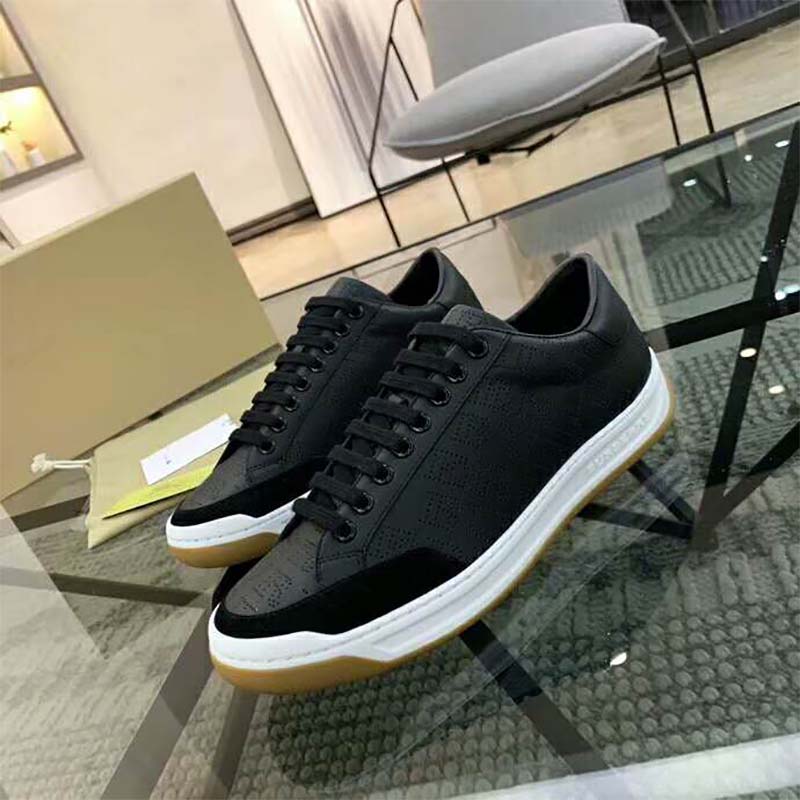 Top angle showing black lace-up closure on Burberry leather sneakers