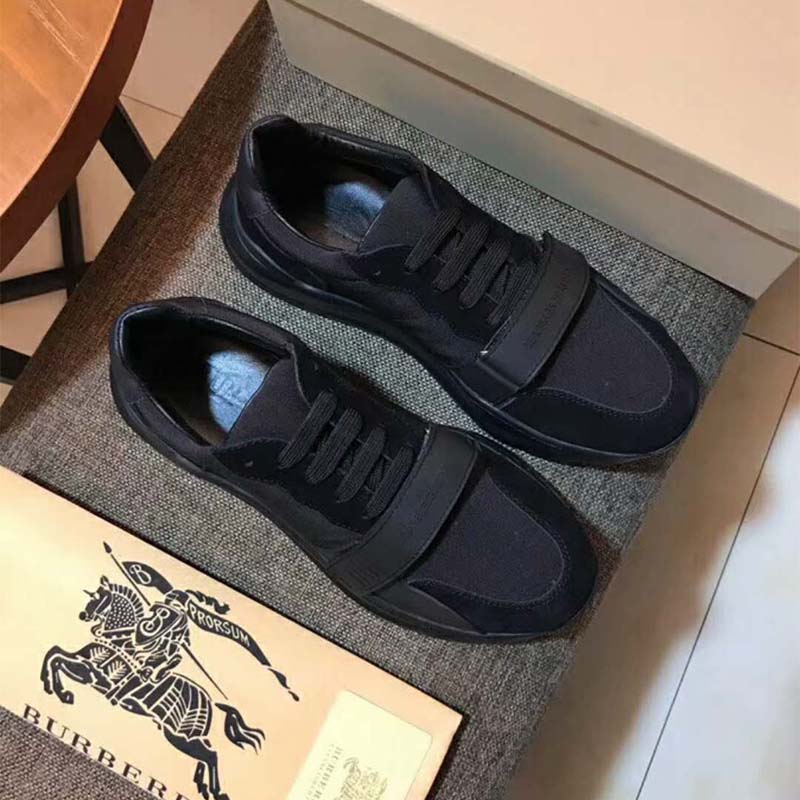 Close-up of black suede and leather textures on Burberry sneakers
