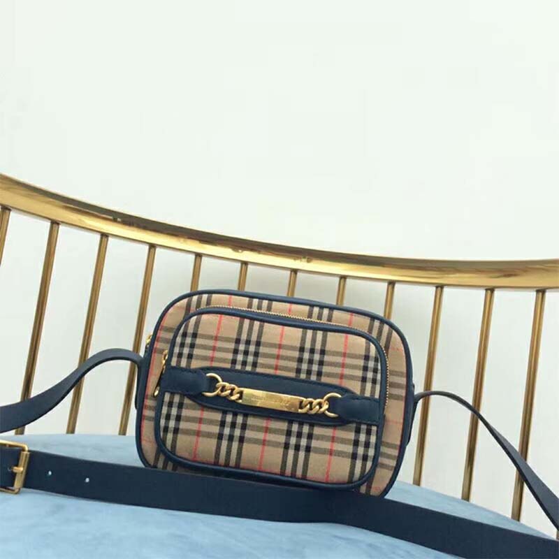 Close-up of signature 1983 check pattern on Burberry camera bag