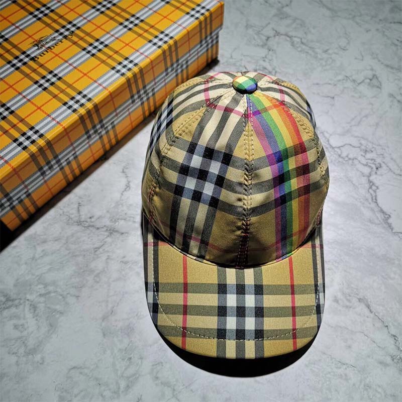 Side angle showcasing adjustable strap on Burberry vintage check cap