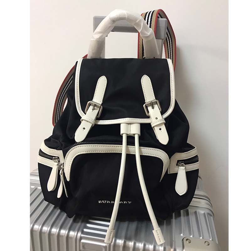 Side angle showing adjustable straps of Burberry Unisex The Medium Rucksack