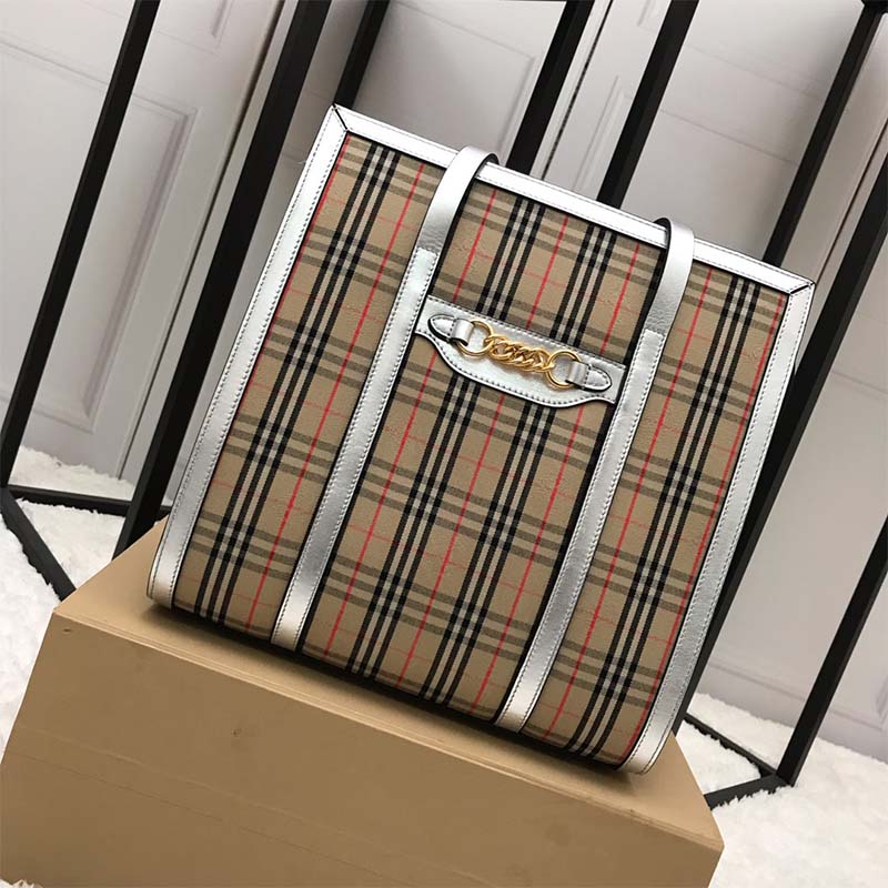 Side profile showing brown leather and vintage check on Burberry Unisex Tote Bag