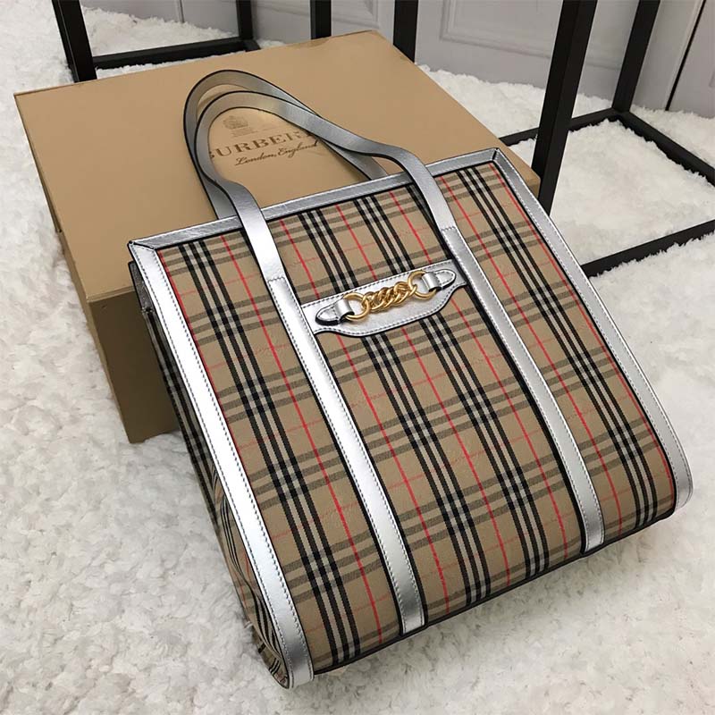 Close-up of gold link hardware on Burberry Unisex The Small 1983 Check Link Tote Bag