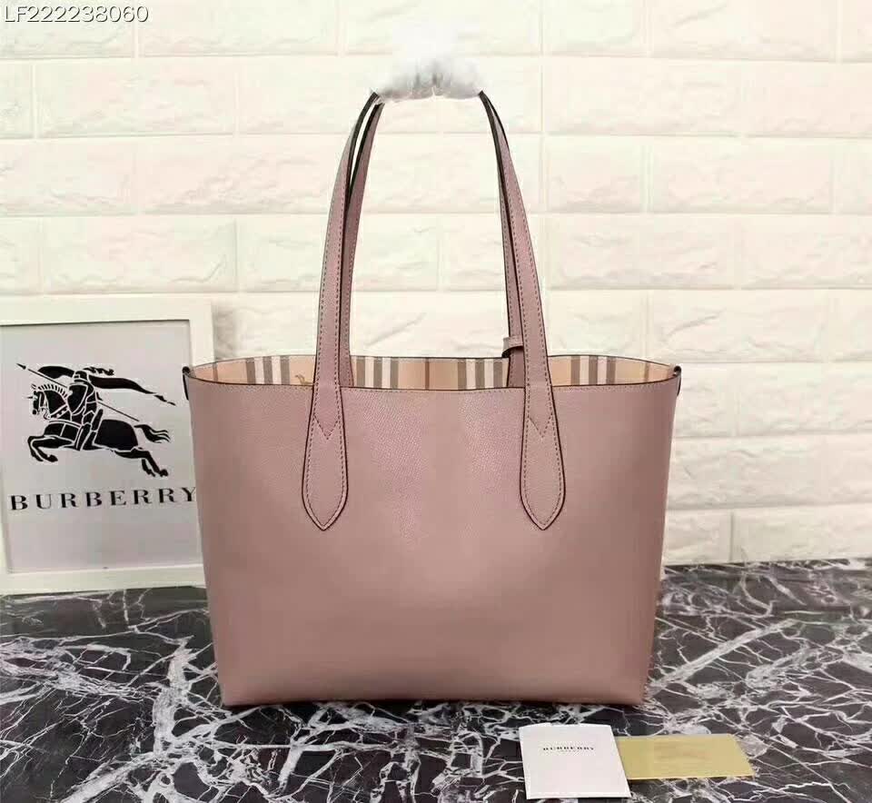 Side angle showing silver hardware and pink leather on Burberry tote