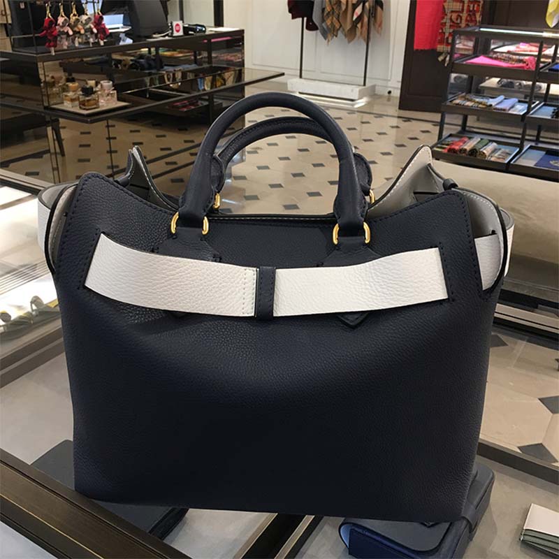 Side view highlighting smooth navy leather texture of Burberry Women Large Leather Belt Bag-Navy