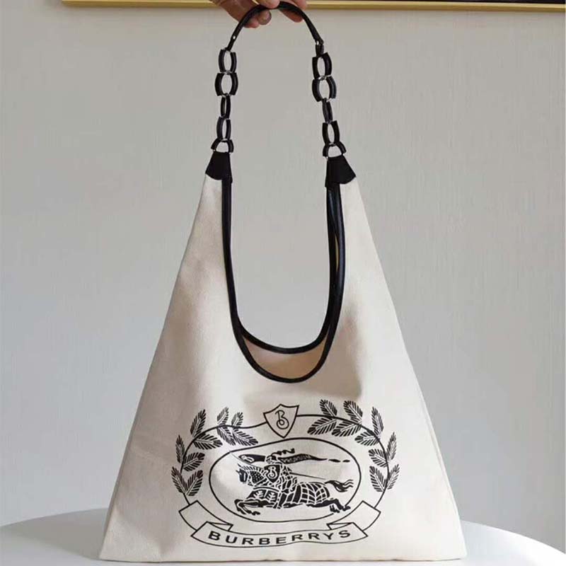 Close-up of Burberry Archive logo and gold-tone hardware on shopper