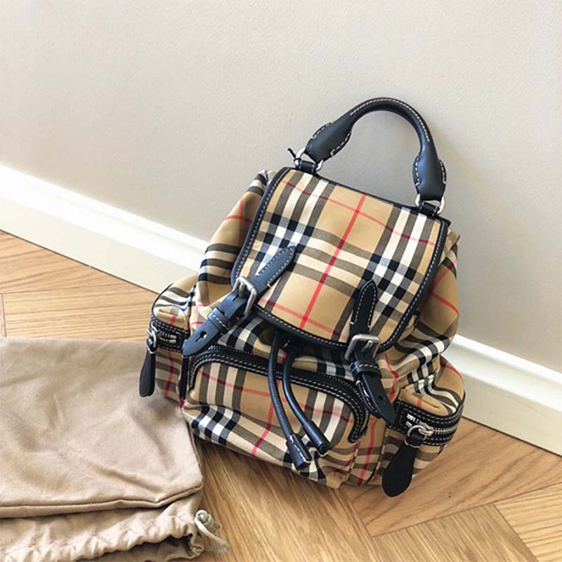 Side angle showing adjustable straps of Burberry Women Medium Rucksack in Sandy