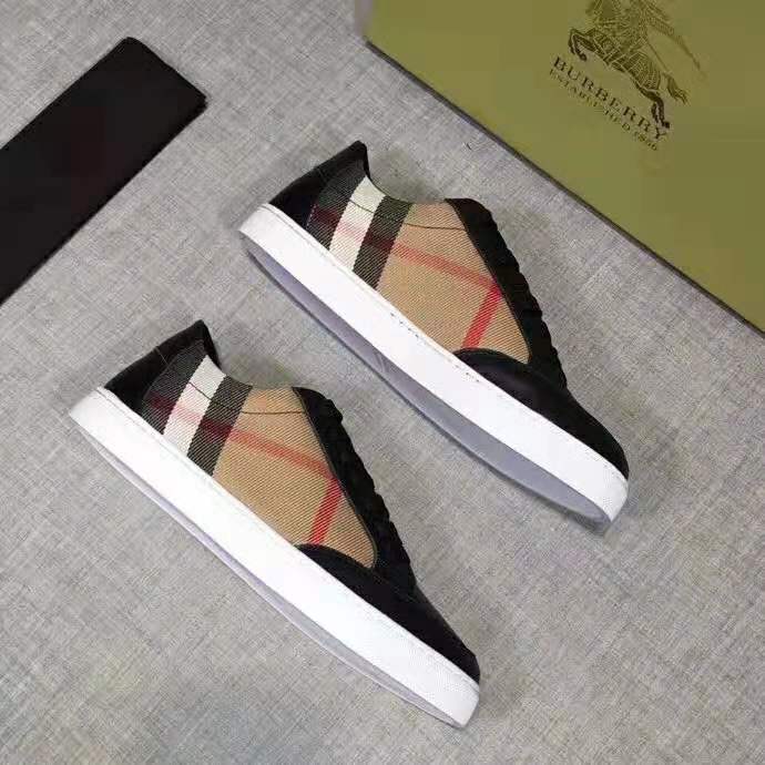 Close-up of lace-up closure and black leather on Burberry Women Shoes Check Detail Leather Sneakers-Black
