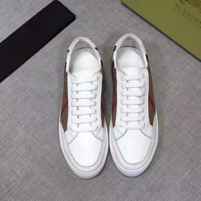 Close-up of signature Burberry check detail on leather sneakers in white