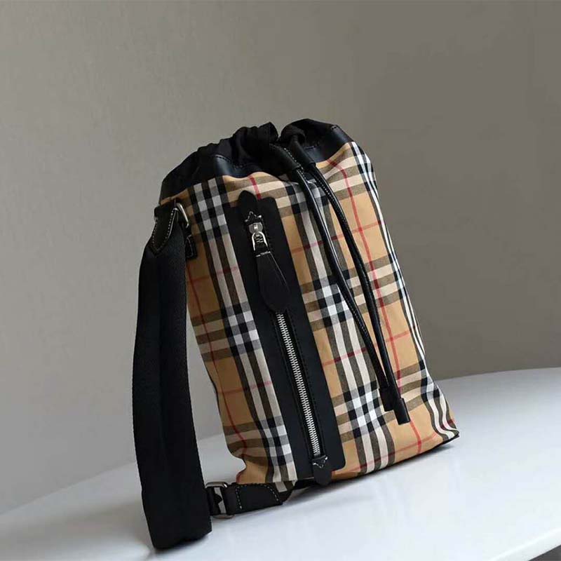 Side angle showing brushed gold hardware on Burberry vintage check bag