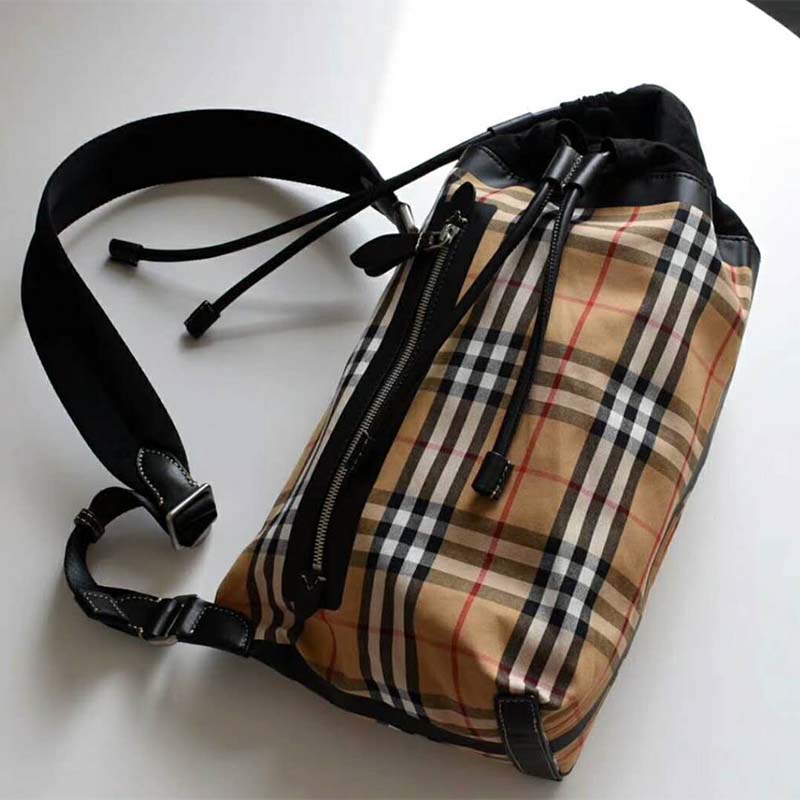 Close-up of vintage check pattern and zip on Burberry cotton duffle bag