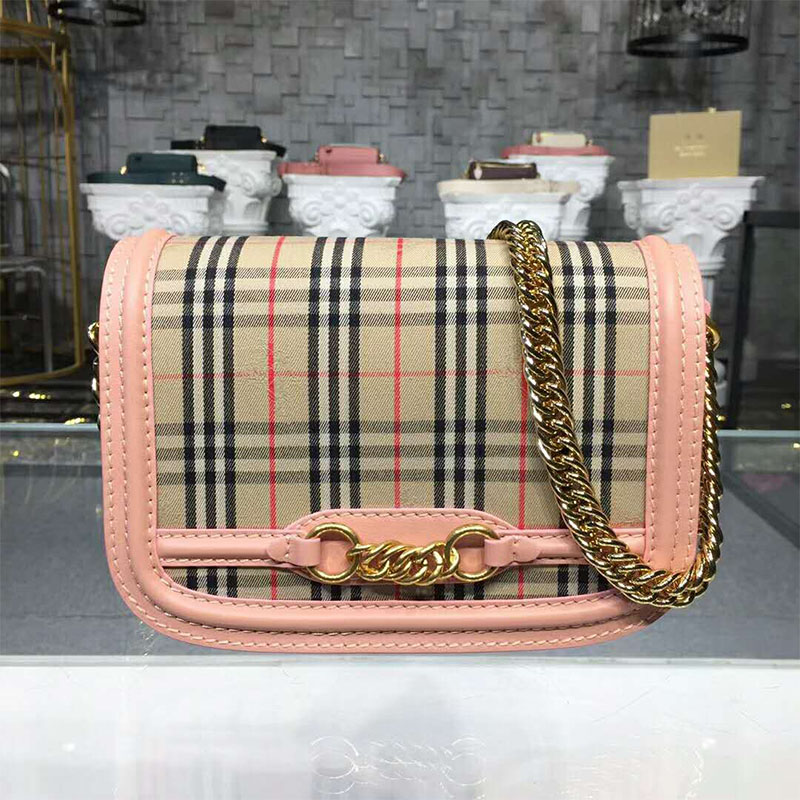 Close-up of pink leather trim and gold-tone link hardware on Burberry 1983 Check Link Bag