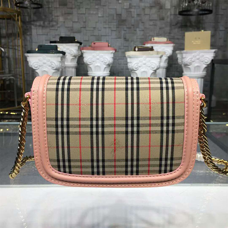 Side angle showing compact silhouette of Burberry Women The 1983 Check Link Bag Pink