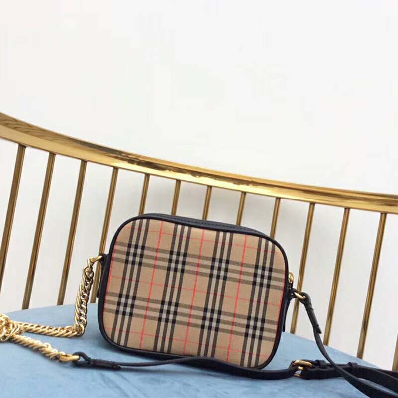 Side profile showing silhouette and leather texture of Burberry camera bag