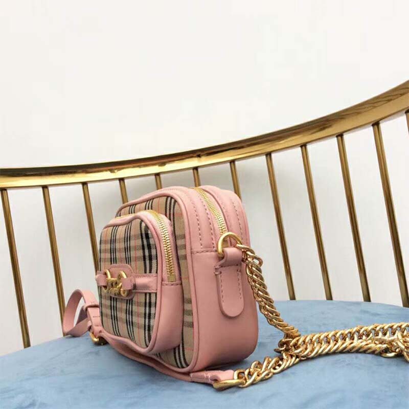 Side profile showing zip closure and pink leather texture on Burberry Women The 1983 Check Link Camera Bag-Pink