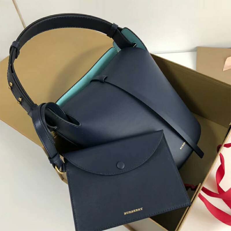 Close-up on polished hardware and drawstring of Burberry leather bucket bag