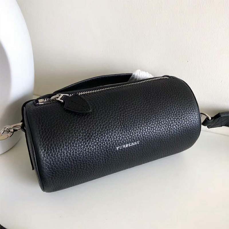 Side angle showing the zip closure of Burberry Women The Leather Barrel Bag-Black
