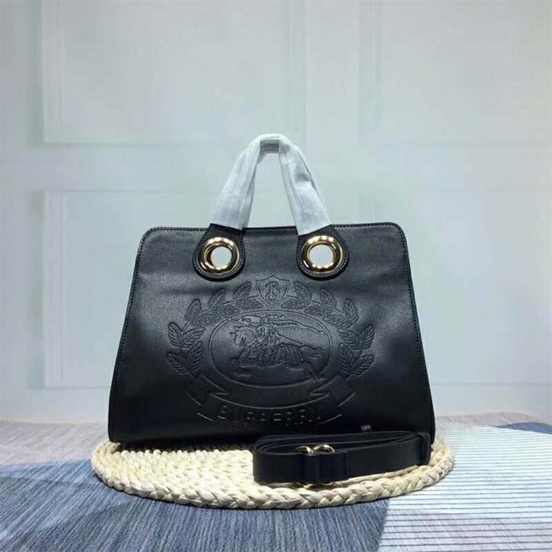 Close-up of silver grommet detail on Burberry tote black leather