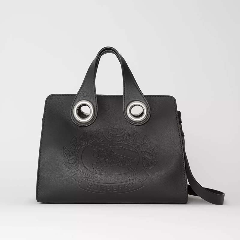 Front view of Burberry Women The Leather Crest Grommet Detail Tote-Black