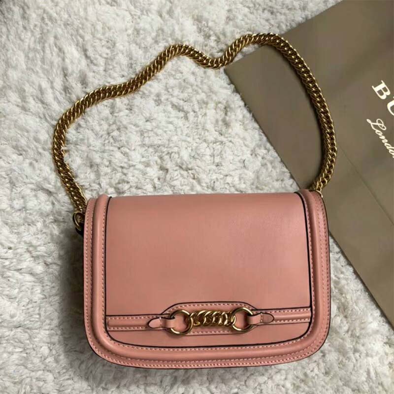 Side angle showing compact silhouette of Burberry Women The Leather Link Bag-Pink