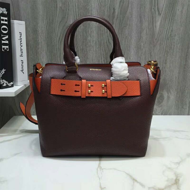 Side angle showing adjustable strap of Burberry Women The Medium Leather Belt Bag-Maroon