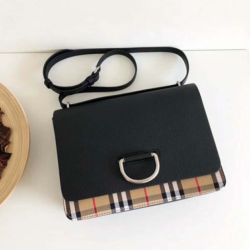 Close-up of the D-ring closure on Burberry Women The Medium Vintage Check Leather D-Ring Bag-Black