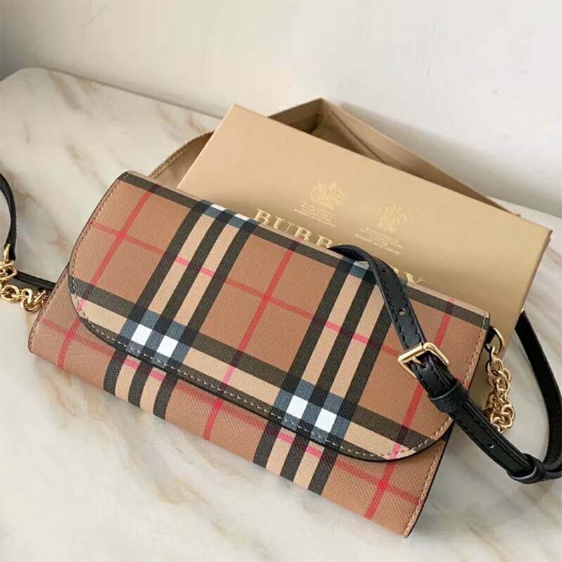 Side angle showing compact silhouette of Burberry Women Vintage Check and Leather Wallet