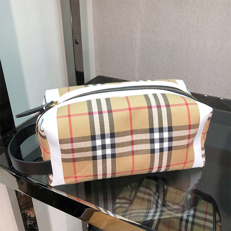 Close-up of signature check pattern on Burberry cotton pouch