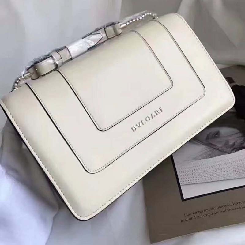 Side angle showing gold chain strap on Bvlgari Serpenti Forever Medium Flap Cover Chain Bag