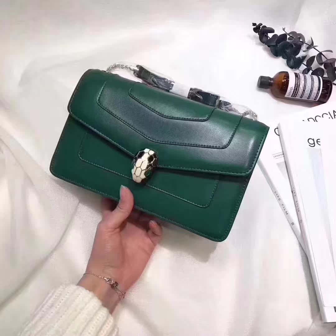 Close-up of signature snakehead clasp on Bvlgari Serpenti Forever bag