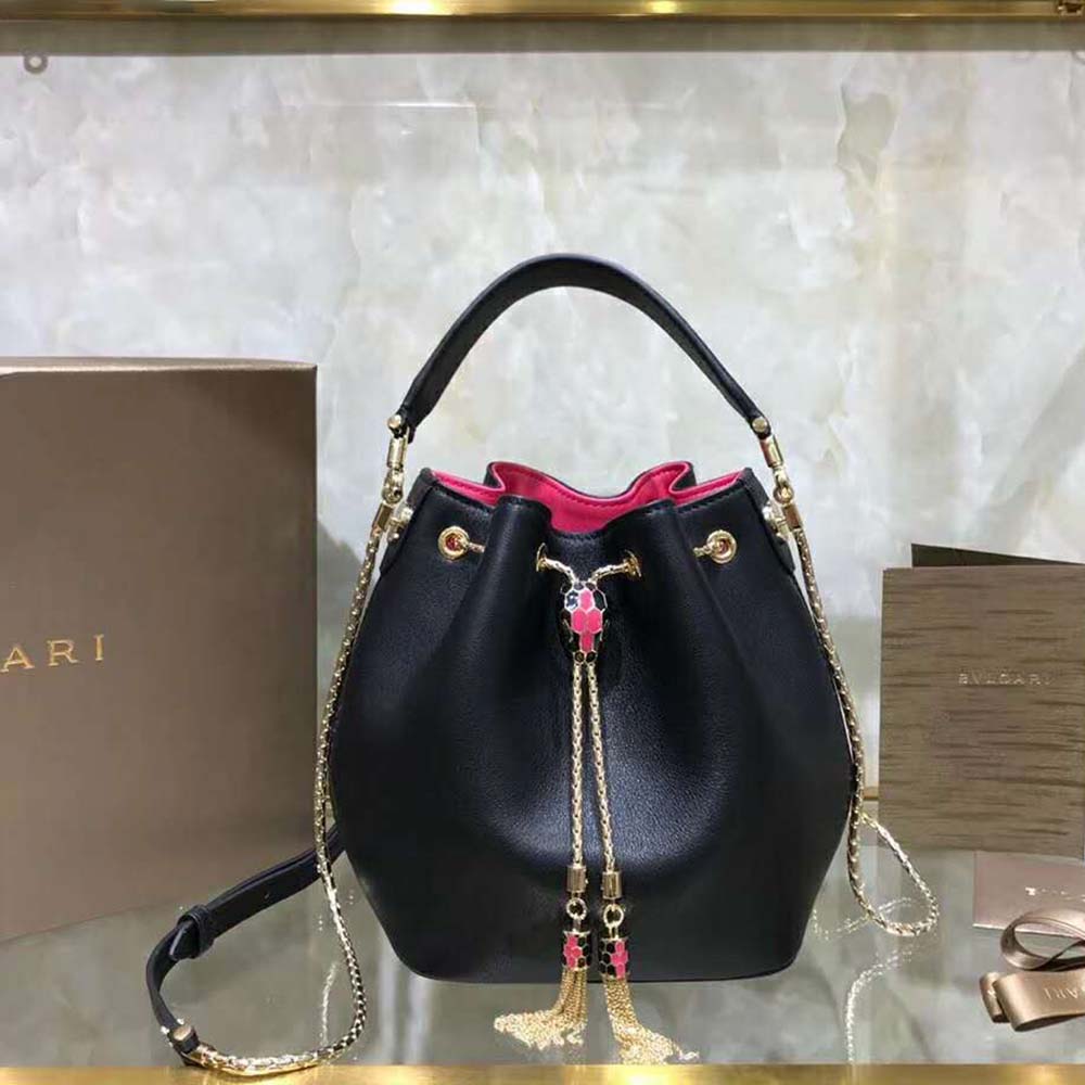 Close-up of Serpenti snake head hardware on Bvlgari Women Bucket Serpenti Forever