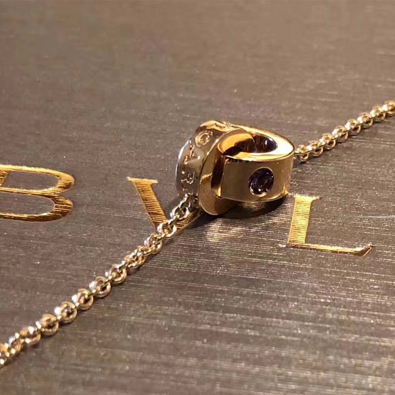 Top angle showing engraved logo on Bvlgari Women Bvlgari Bvlgari 18 KT Rose Gold Bracelet Set