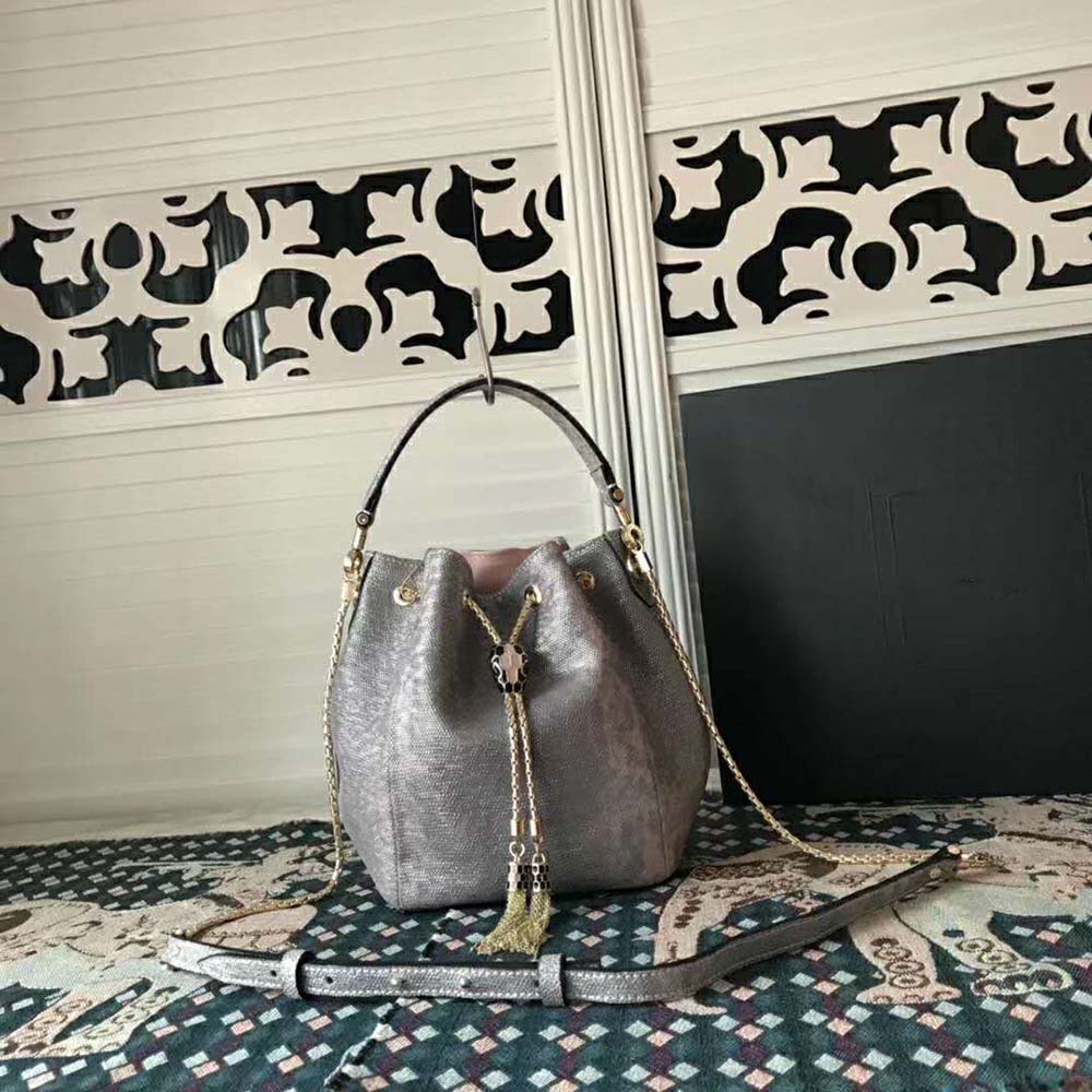 Side angle showing compact bucket silhouette of Bvlgari Women Serpenti Forever Bucket-Silver