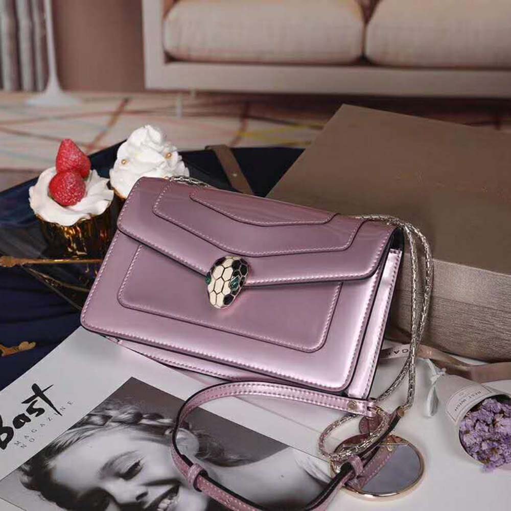 Close-up of the signature serpent head closure on Bvlgari pink handbag