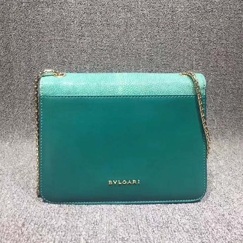 Side angle showing structured silhouette of Bvlgari Serpenti Forever Medium bag