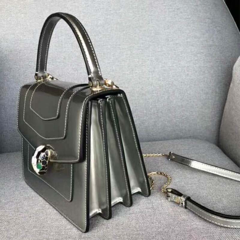 Side profile showing flap and silver leather texture on Bvlgari Serpenti Forever bag