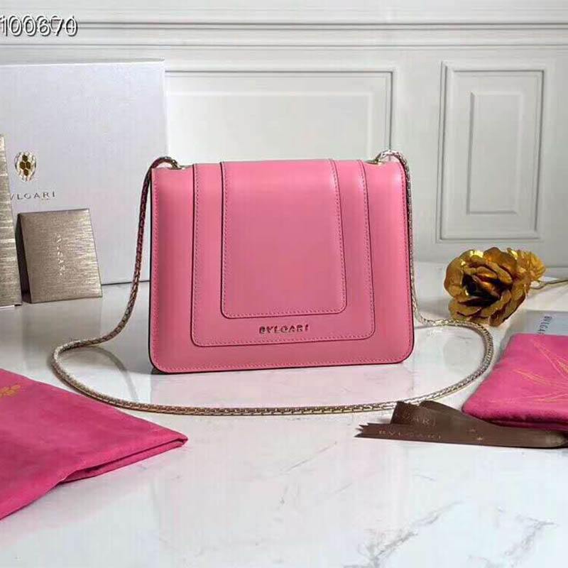 Close-up of gold-tone Serpenti coil closure on pink handbag