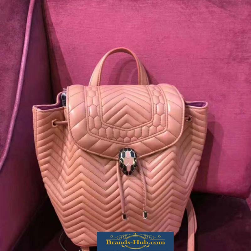 Close-up of Serpenti snake-head hardware on Bvlgari pink leather backpack