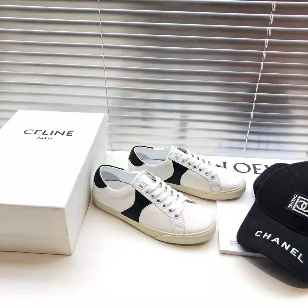Close-up on stitched white calfskin and Triomphe logo hardware detail