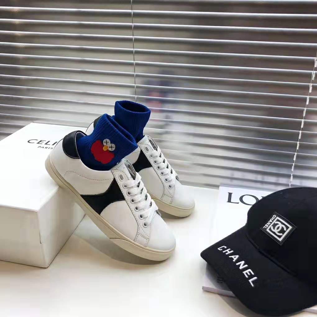 Top view of Celine Triomphe low lace-up sneaker in white calfskin