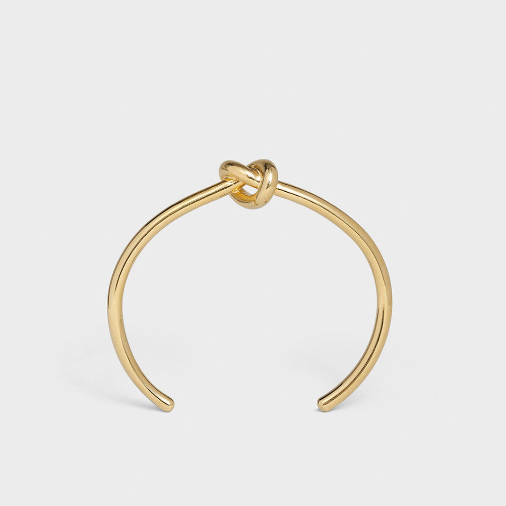 Close-up of Celine Women Knot Extra-Thin Bracelet showcasing gold knot detail