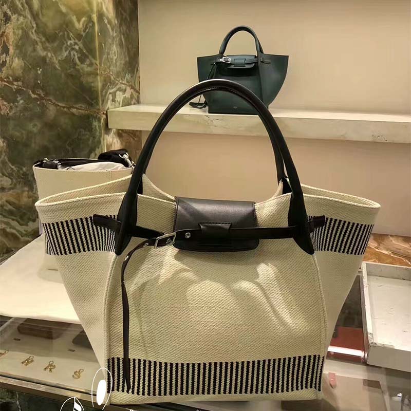 Close-up of textured canvas and gold-tone hardware on Celine bag