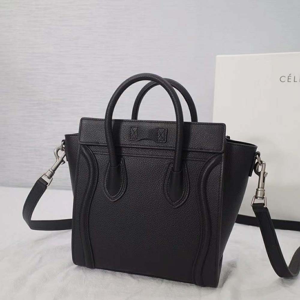 Close-up on silver zipper and signature luggage curve detail