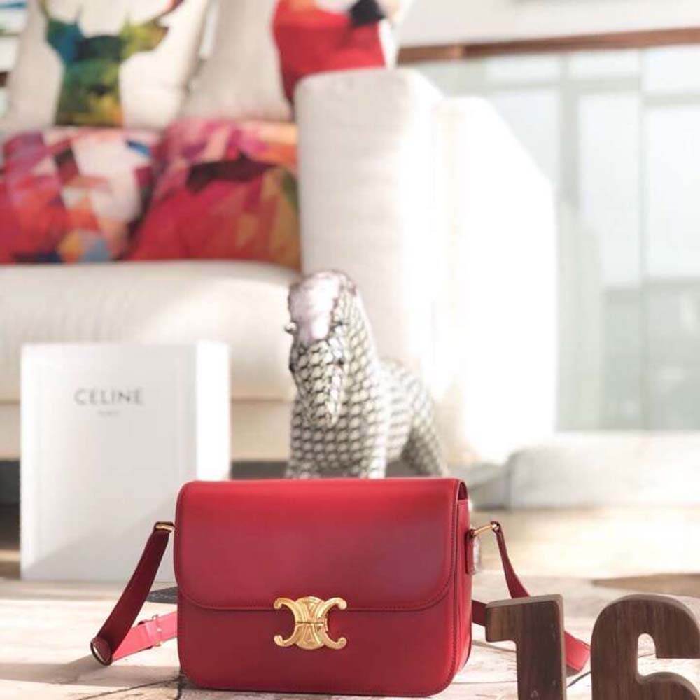 Close-up of gold Triomphe clasp on red calfskin Celine Teen Bag