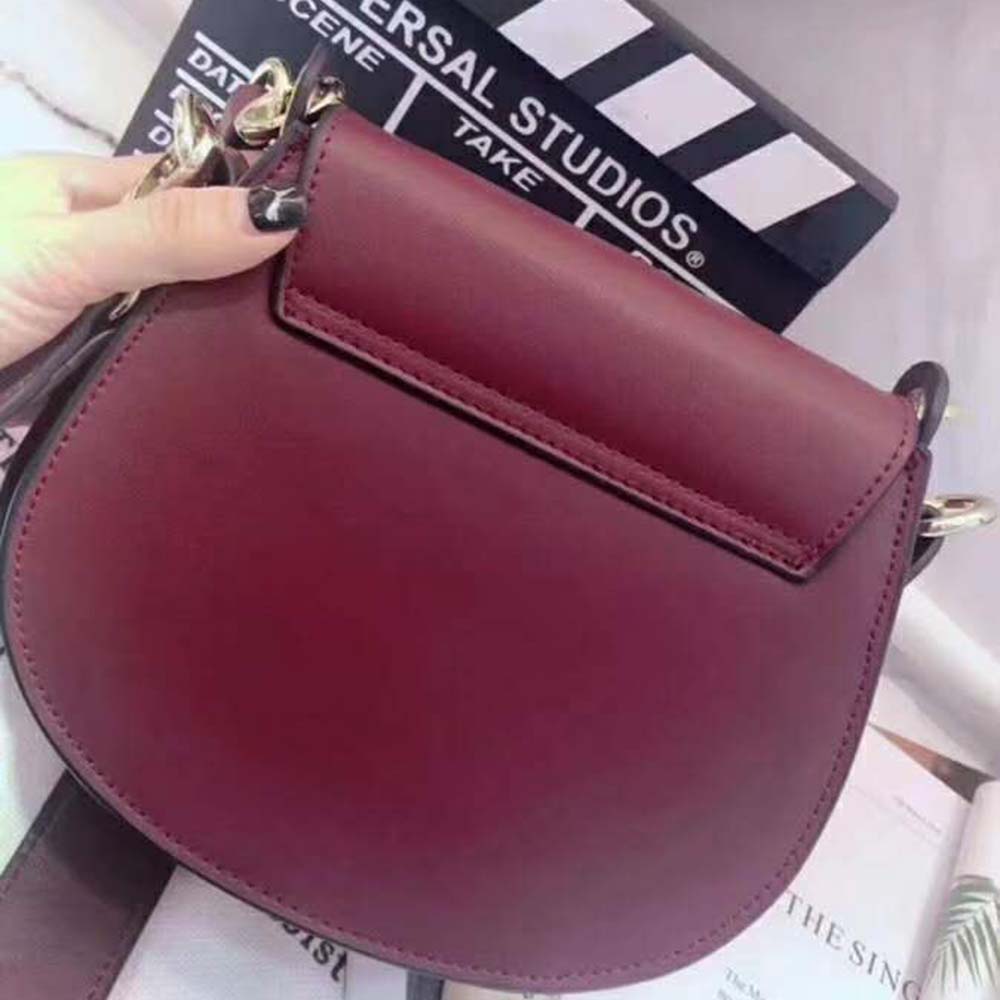 Side angle showing texture contrast on Chloe Women Small Tess Bag maroon