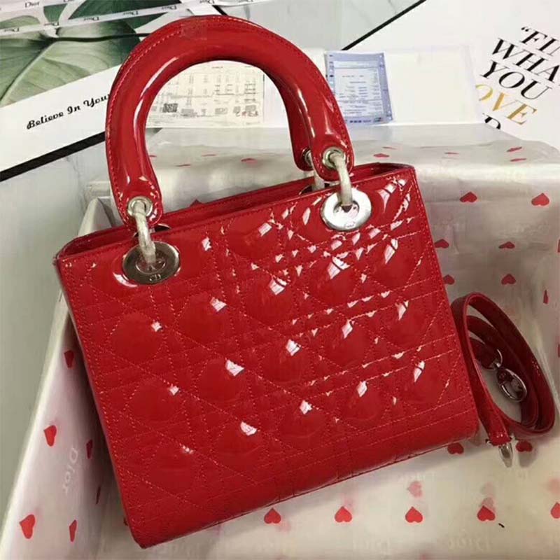 Close-up of silver D.I.O.R. charms on Dior Lady Dior Bag