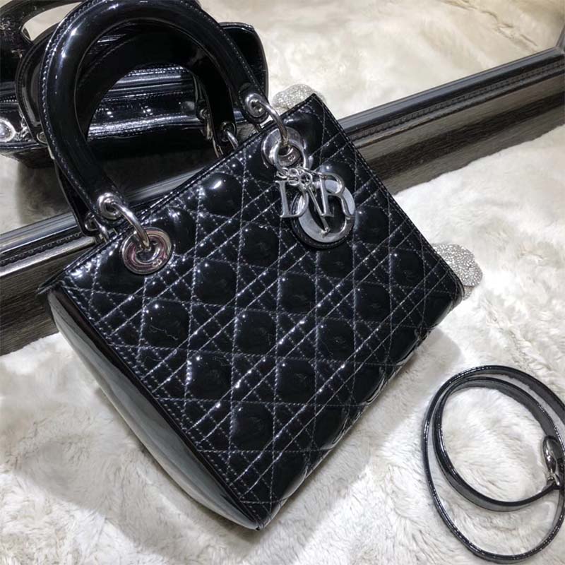 Side angle showing adjustable strap and glossy patent leather finish