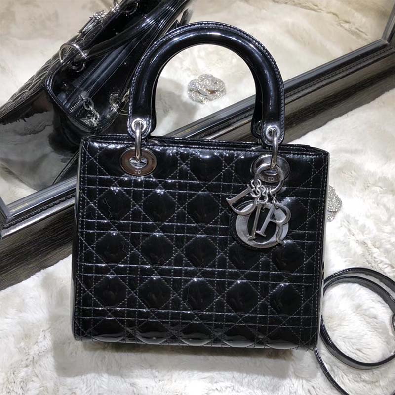 Close-up of signature cannage stitching and silver charms on Lady Dior Bag