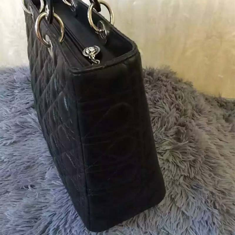 Side angle showing silver hardware on Dior Large Lady Dior Bag